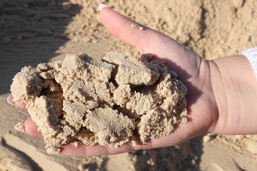 high-quality sand shown in hands image